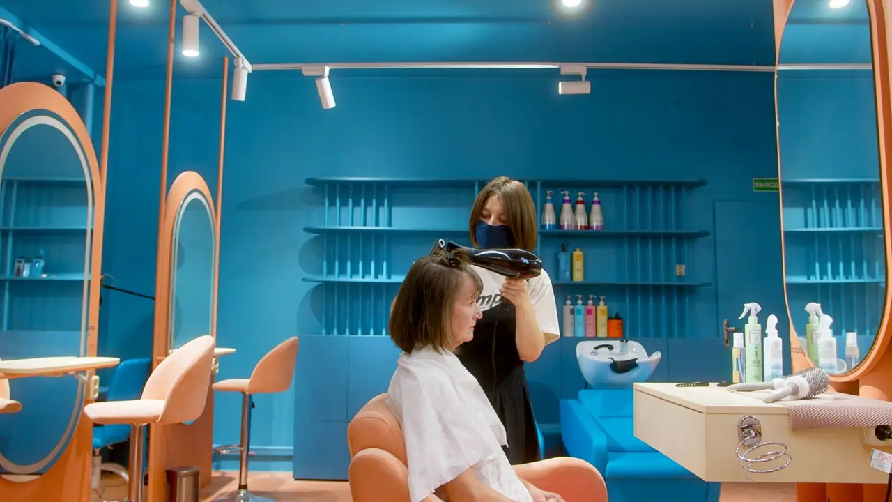 Stylist working in a bright salon